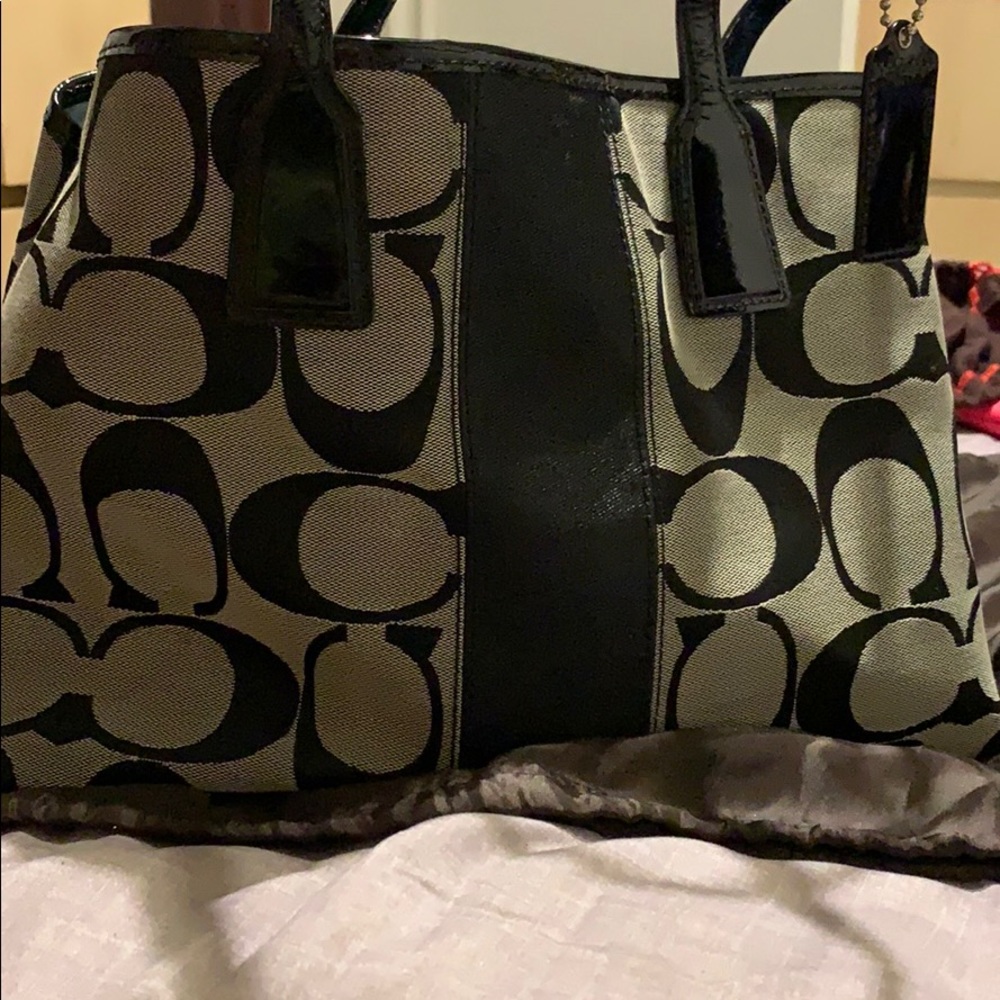 Black & gray signature coach bag.